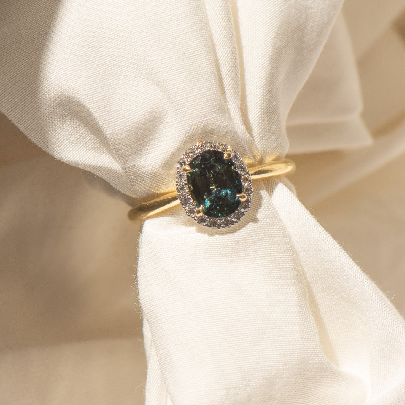 18K Yellow Gold Oval Parti Sapphire Halo Engagement Ring.